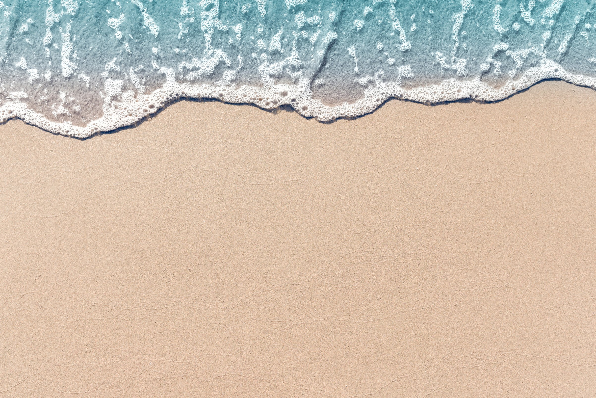 Soft wave lapped the sandy beach, Summer Background.